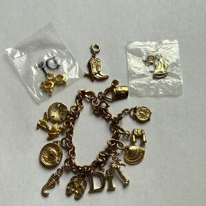 Diamonds International Cruise Ship Charm Bracelet. 13 charms included & Di charm